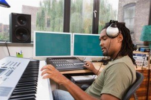 music producers work with studio equipment